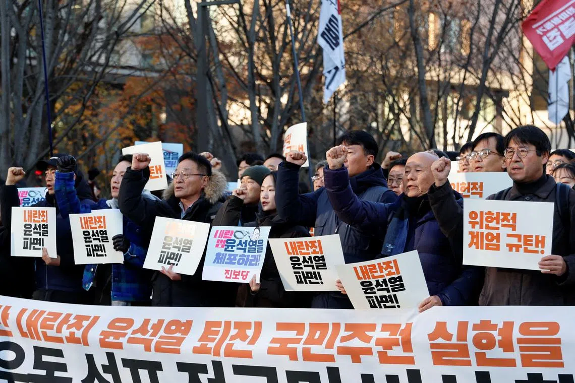 People take part in a rally to demand South Korean President Yoon Suk Yeol's removal from power, in Seoul, South Korea, December 4, 2024. REUTERS/Kim Soo-hyeon
