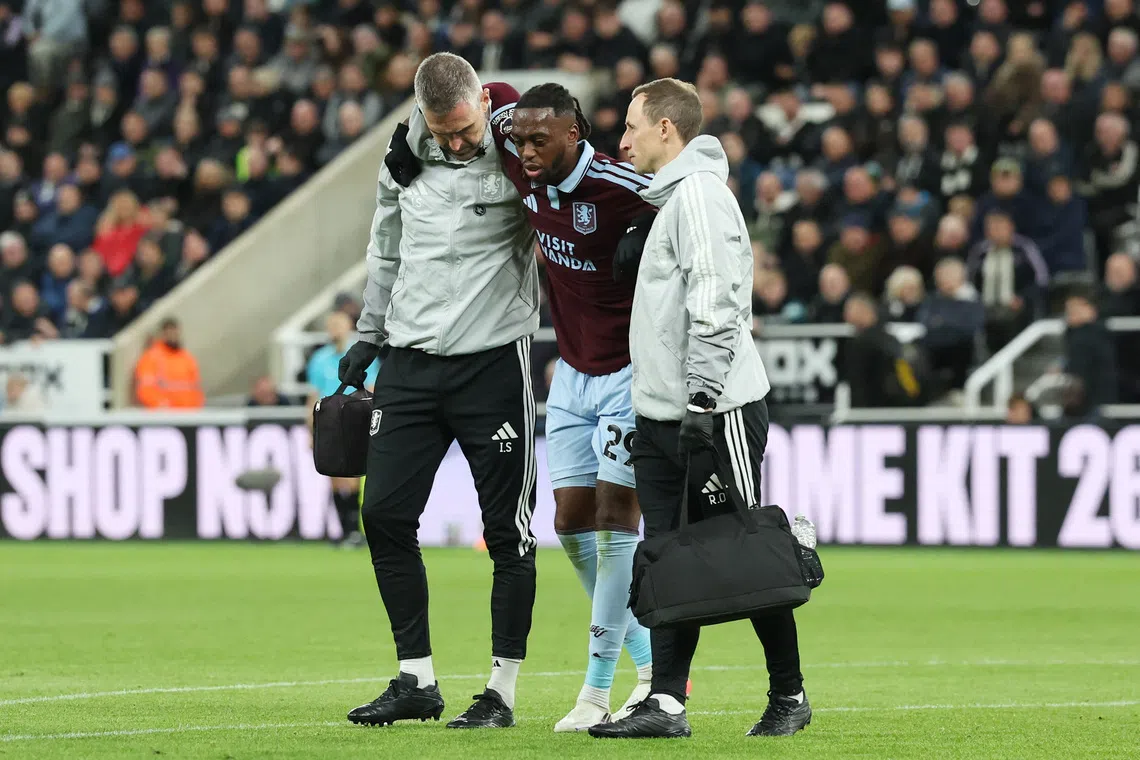 Soccer Football - Premier League - Newcastle United v Aston Villa - St James' Park, Newcastle, Britain - October 17, 2026 Aston Villa's Aaron Wan-Bissaka is helped off the pitch after sustaining an injury REUTERS/Scott Heppell/ File Photo