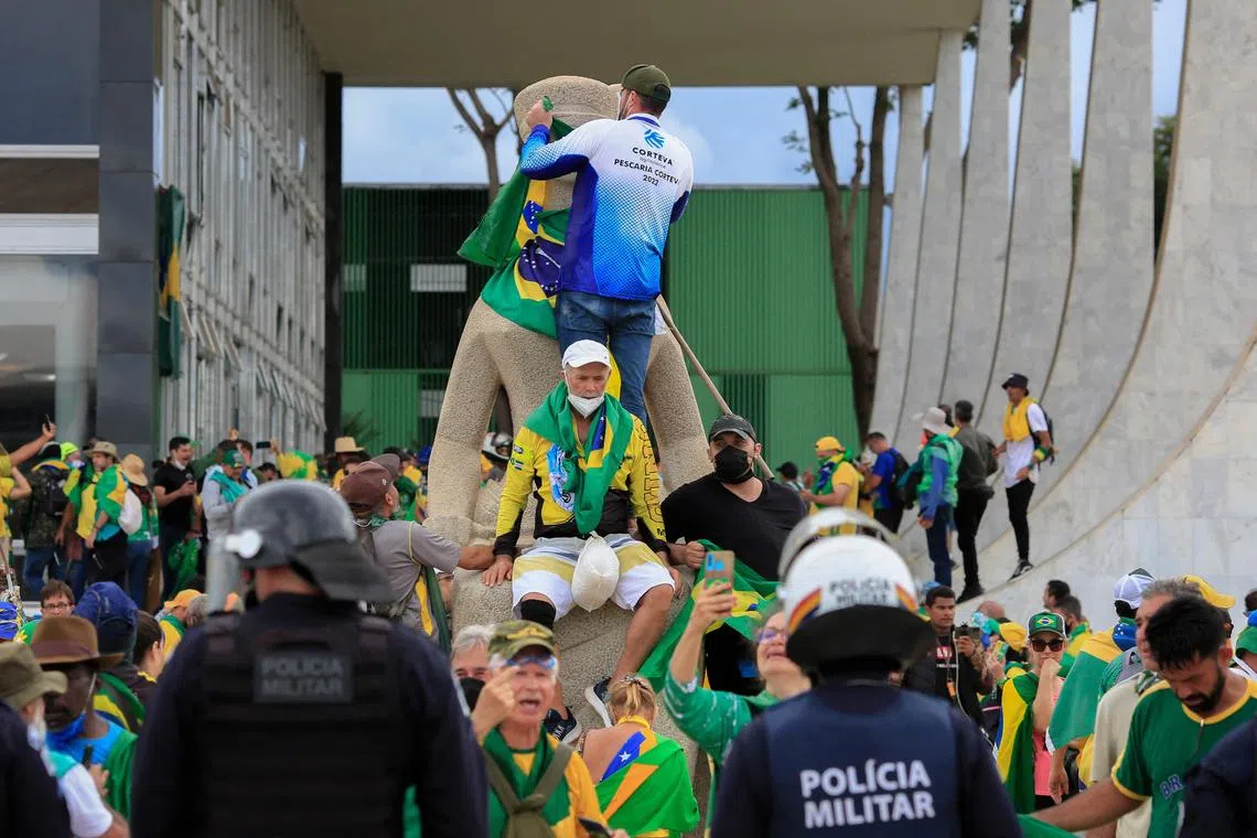 Supporters of Brazilian former president Jair Bolsonaro invade the presidential palace in Brasilia on Jan 8, 2023.