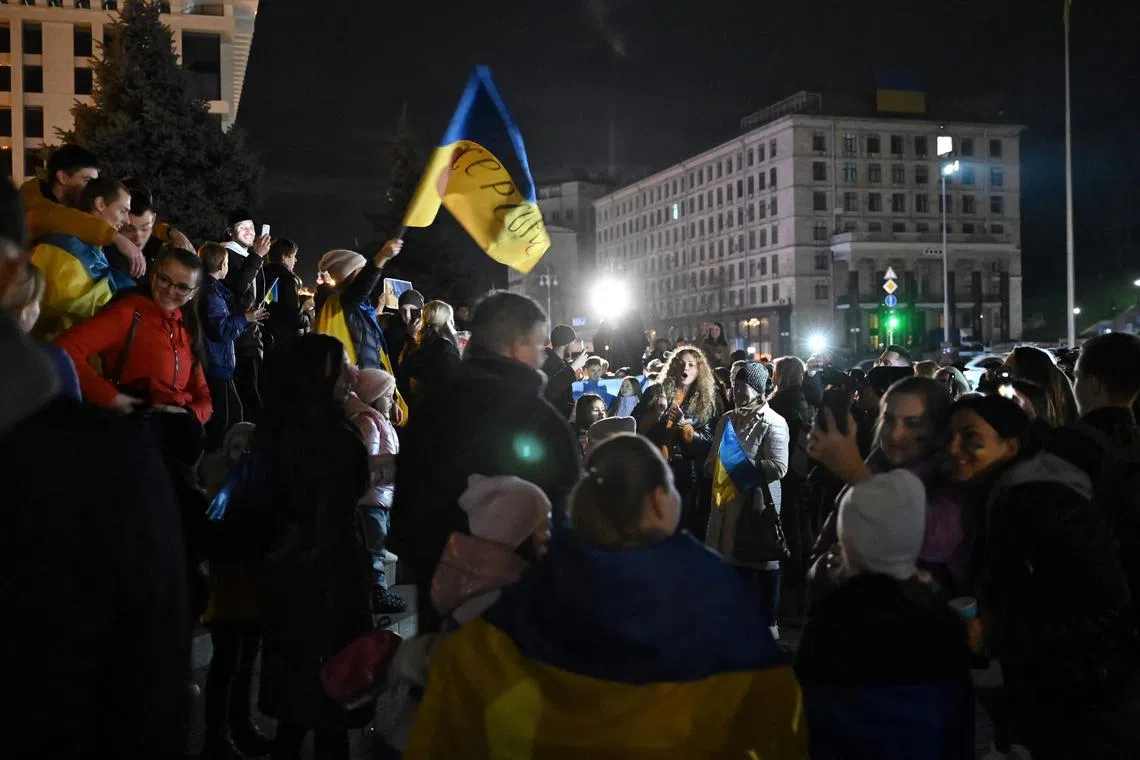 Ukraine’s parliament published a video of the national anthem being played in a central Kherson square as people sang along.