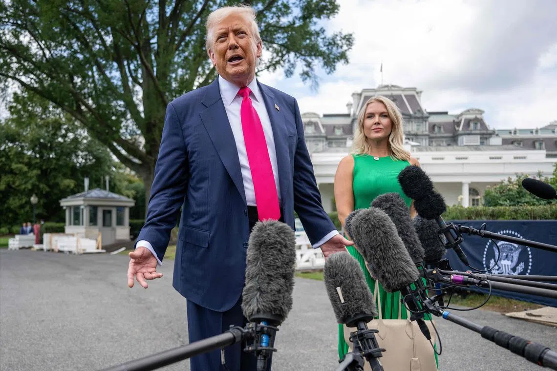 US President Donald Trump, alongside White House press secretary Karoline Leavitt, speaking to reporters on the South Lawn of the White House on July 15.