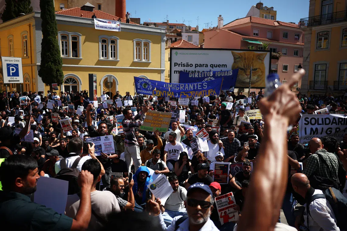 Migrants protest in front of the Portuguese parliament for rights and residency permits, in Lisbon, Portugal, September 17, 2025. REUTERS/Pedro Nunes