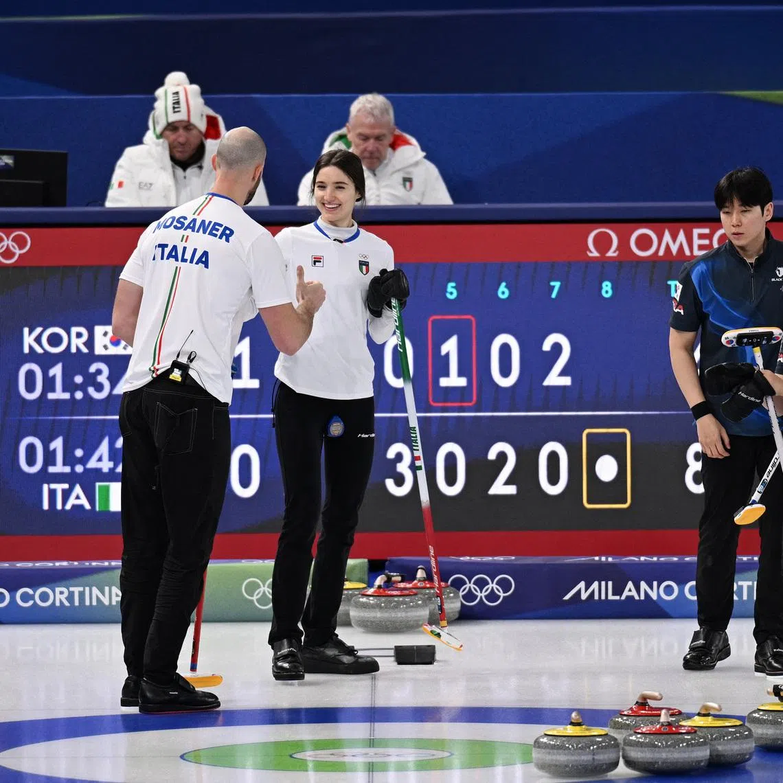 Milano Cortina 2026 Olympics - Curling - Mixed Doubles Round Robin Session 2 - South Korea vs Italy - Cortina Curling Olympic Stadium, Cortina d'Ampezzo, Italy - February 05, 2026. Stefania Constantini of Italy and Amos Mosaner of Italy celebrate winning their match against Seonyeong Kim of South Korea and Yeongseok Jeong of South Korea REUTERS/Jennifer Lorenzini