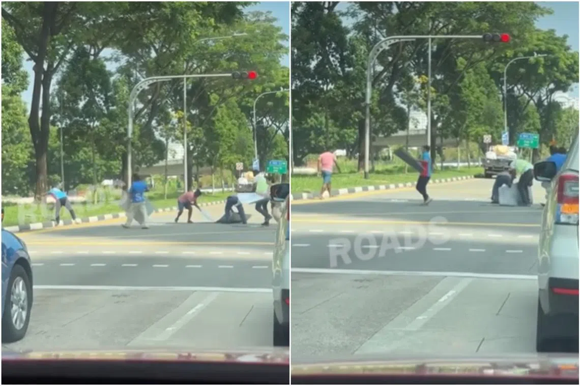 Eight different individuals can be seen sprinting towards the pile, and scrambling to clear it before the light turns green. 