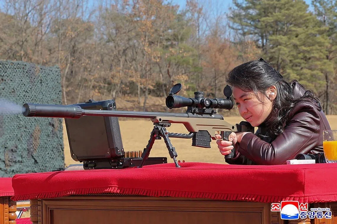 This picture taken on Feb 27, 2026 and released by North Korea's official Korean Central News Agency (KCNA) on Feb 28 shows North Korean leader Kim Jong Un's daughter Kim Ju Ae firing a new sniper rifle, at an undisclosed place in North Korea. 