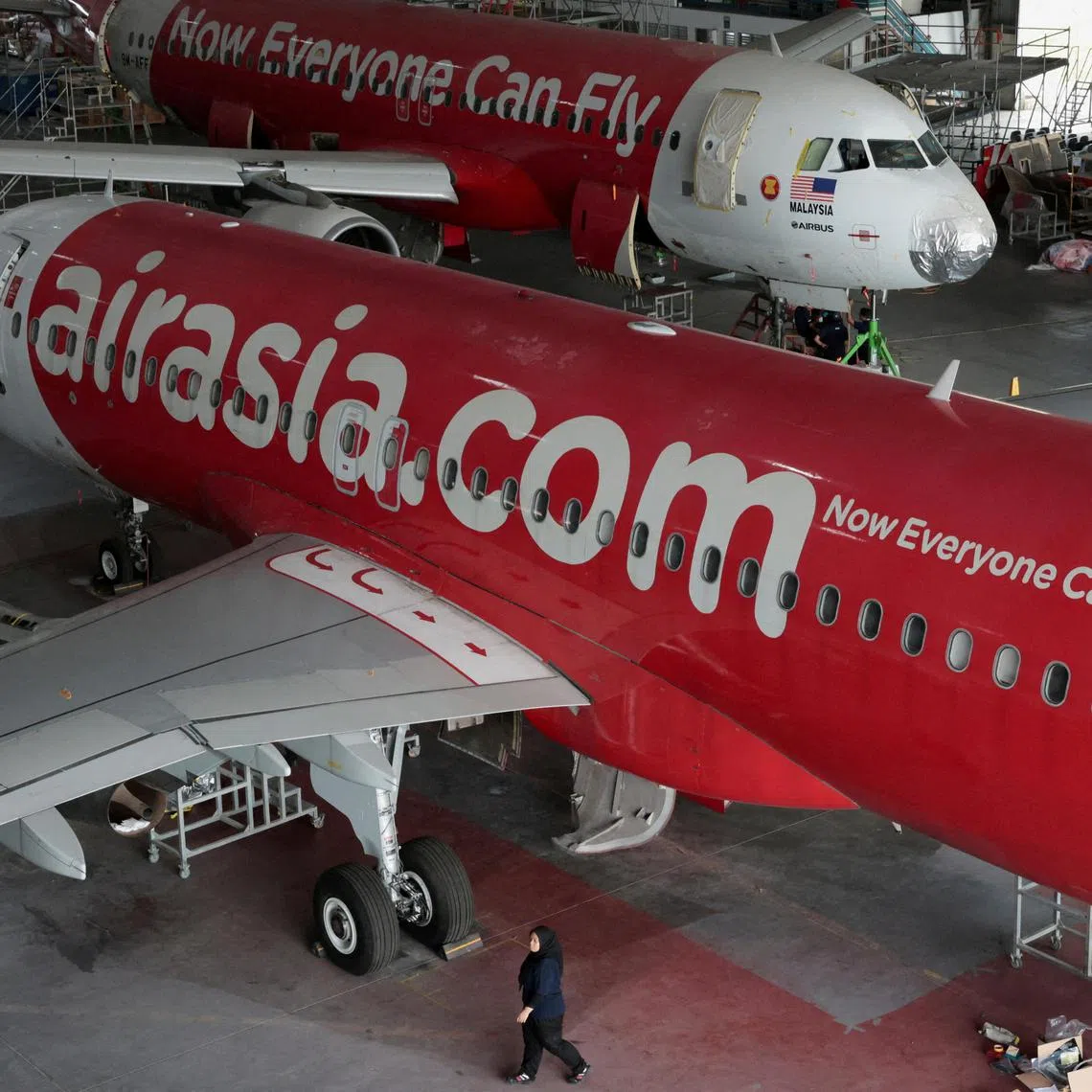 AirAsia aircrafts undergo maintenance in Subang on July 15, 2024. Flight AK128 was en route to Shenzhen on March 26 but turned back to Kuala Lumpur International Airport after a “pneumatic ducting burst” caused a fire in the right engine.