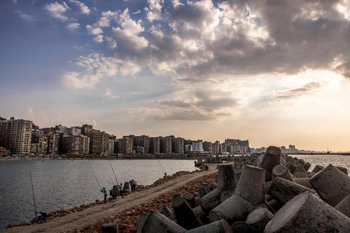 This picture taken on October 31, 2022 shows some of thousands of concrete blocks installed to break the Mediterranean sea waves along the waterfront in Egypt's northern Mediterranean coastal city of Alexandria. 