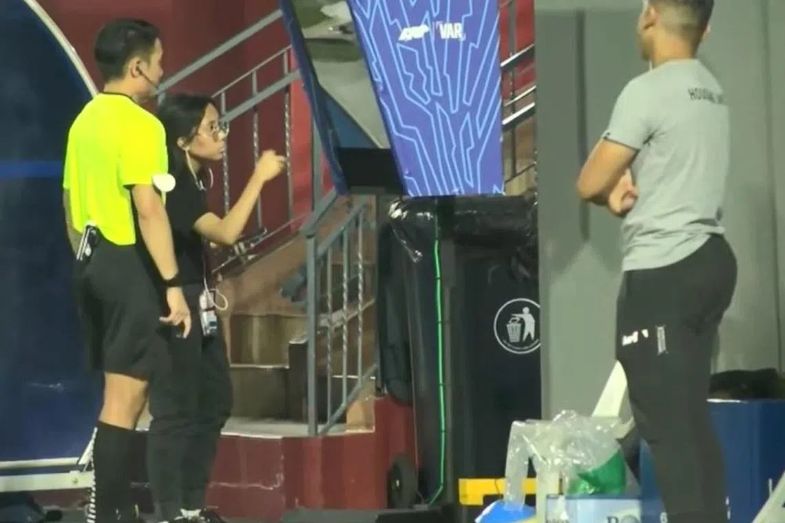 Referee Clarence Leow appeared to request for assistance from a Football Association of Singapore representative with using the pitchside monitor for a video assistant referee on-field review in the Singapore Cup match between Tanjong Pagar and Hougang United at Jurong East Stadium on Sept 25.

SCREENGRAB FROM SINGAPORE PREMIER LEAGUE/YOUTUBE