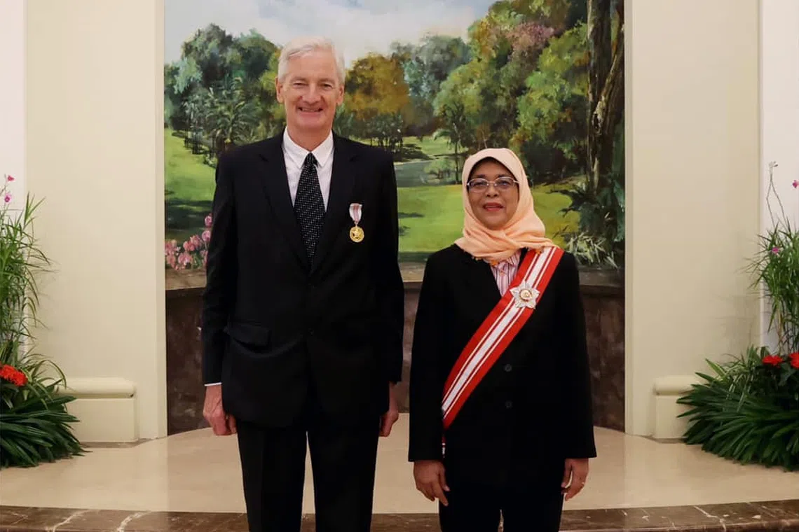 British billionaire James Dyson (left) was presented the award by President Halimah Yacob during a ceremony at the Istana.