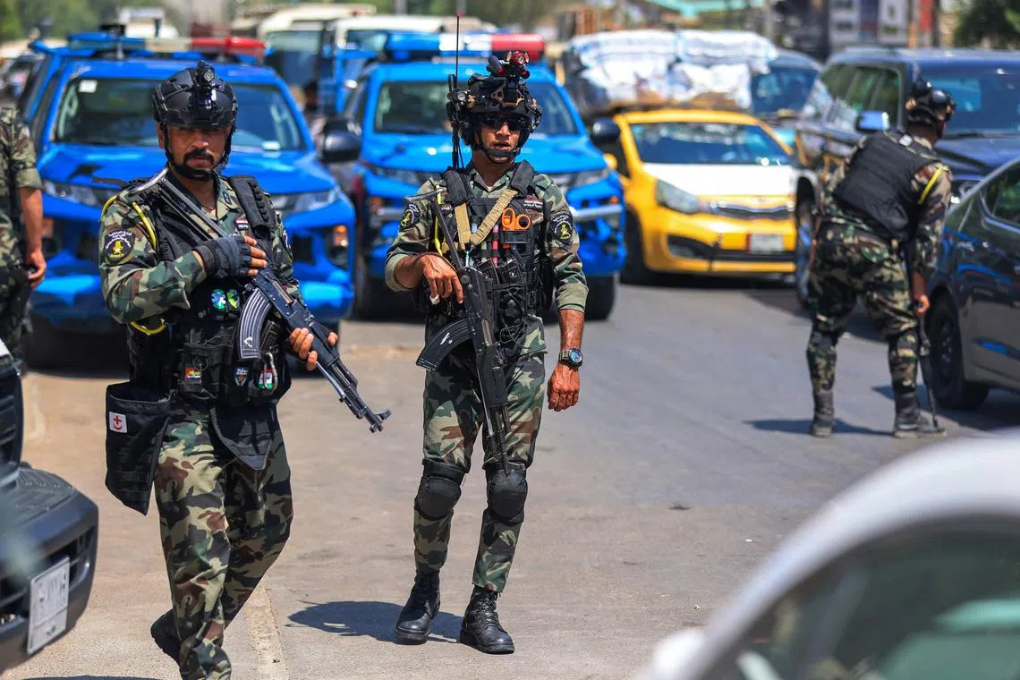 Iraqi security forces standing guard in the capital, Baghdad, on May 26.