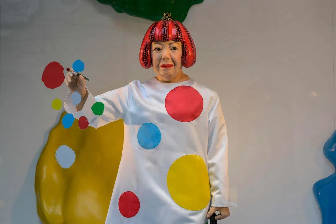 Kusama was often pictured wearing a coloured wig and flashy clothes with her signature polka dot pattern.