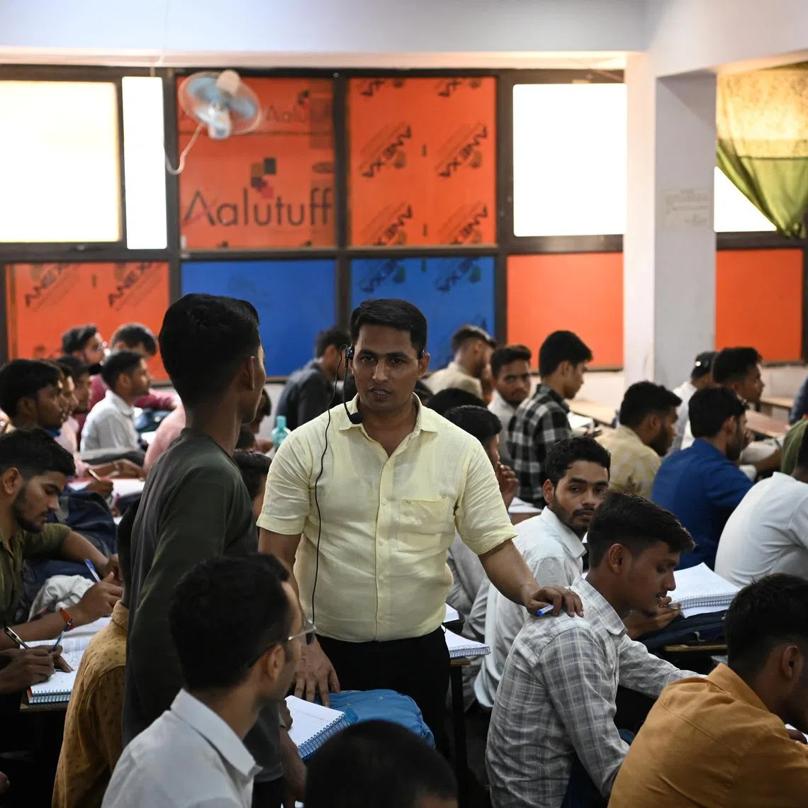 Students attend a coaching class training  them to secure government jobs, in Prayagraj, India, on June 21, 2024.