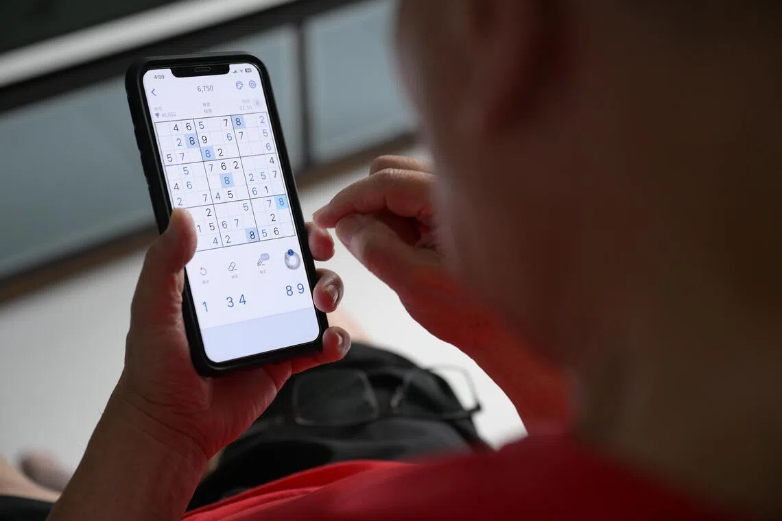 Mr Ho’s iPhone 11 is rarely out of reach.