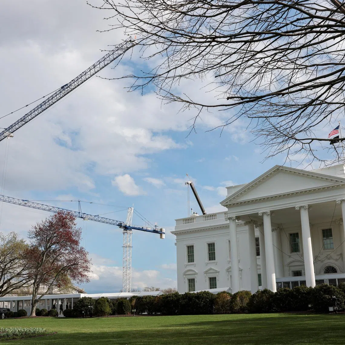 Construction cranes work on White House East Wing renovations in Washington, D.C., U.S., March 17, 2026. REUTERS/Kylie Cooper