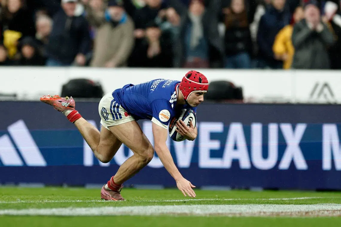France's Louis Bielle-Biarrey scores their fourth try against Ireland on Feb 5.