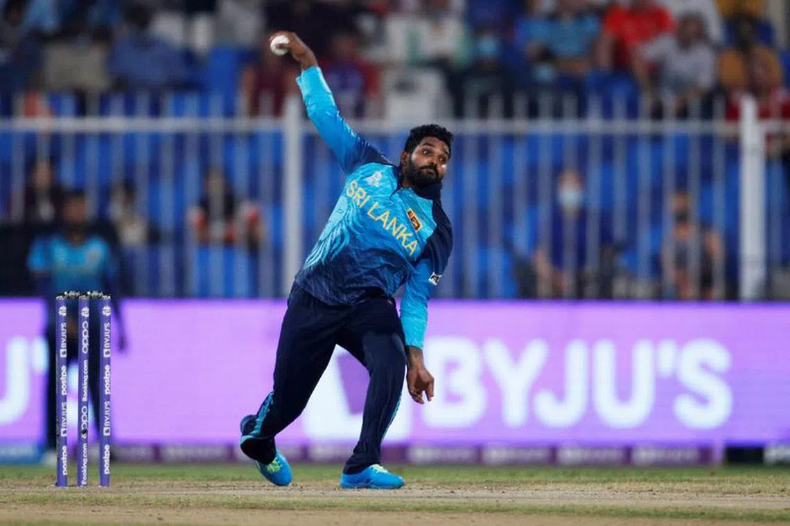 FILE PHOTO:Cricket - ICC Men's T20 World Cup - Super 12 - Group 1 - England v Sri Lanka - Sharjah Cricket Stadium, Sharjah, United Arab Emirates - November 1, 2021 Sri Lanka's Wanindu Hasaranga de Silva in action REUTERS/Hamad I Mohammed/File Photo