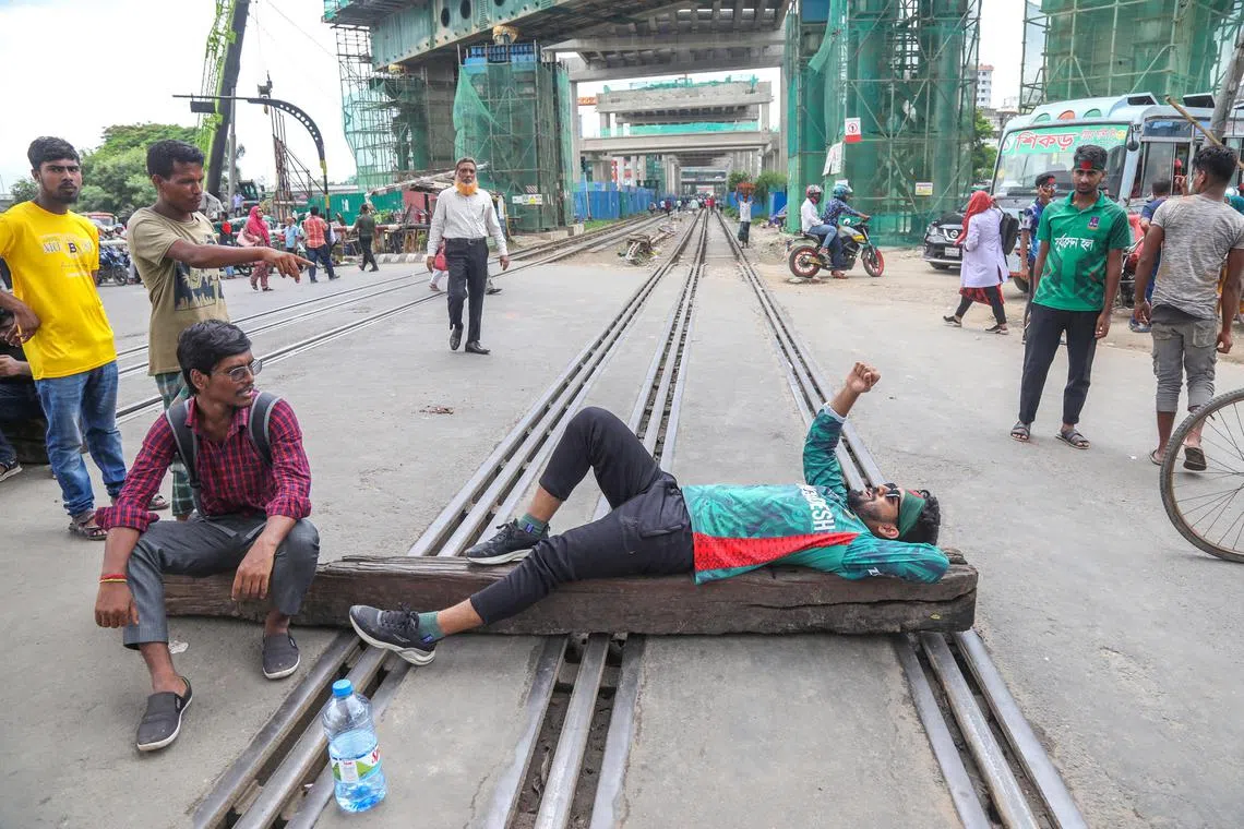 epa11469990 Demonstrators block the Karwan Bazar train line during a 'Bangla Blockade' protest in Dhaka, Bangladesh, 10 July 2024. Hundreds of students protesting under the banner of the 'Anti-Discrimination Student Movement' called a 'Bangla Blockade', as they blocked many intersections in Dhaka and other districts of Bangladesh, demanding the cancellation of the quota system in government jobs. The students have been demonstrating for the last seven days.  EPA-EFE/MONIRUL ALAM