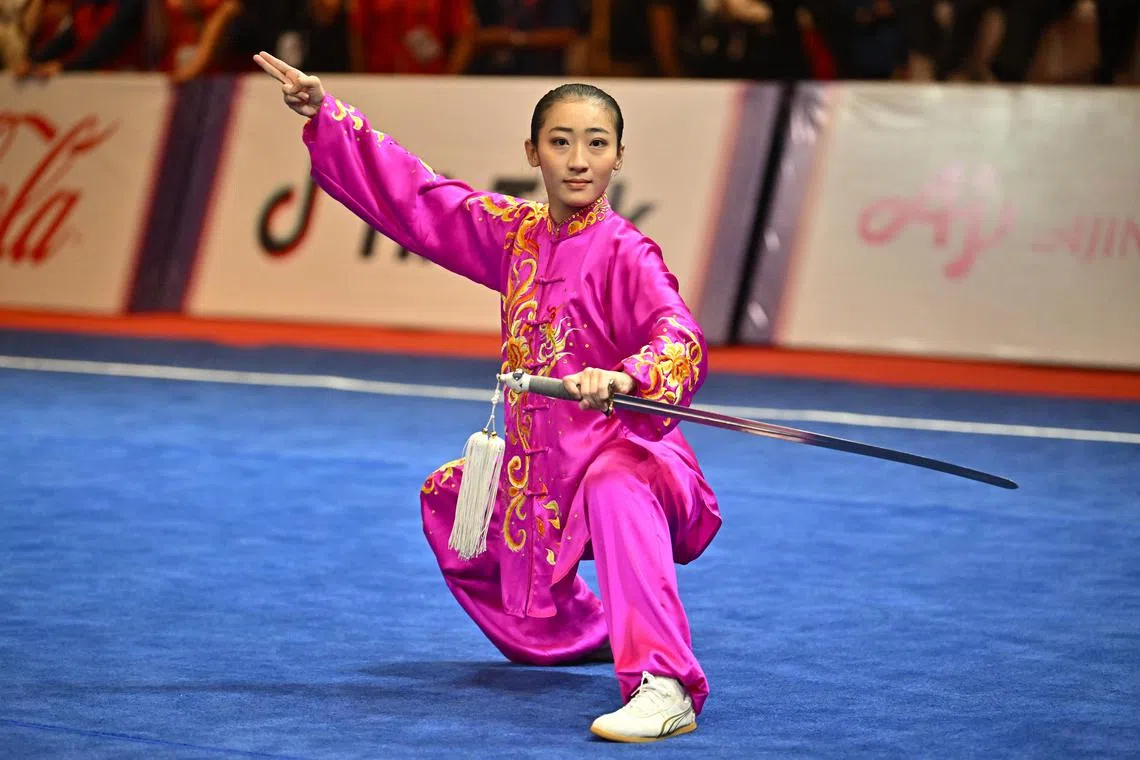 Zeanne Law from Singapore performing in the women Taijiquan and Taijijian combined finals of the wushu competition at the Cambodia SEA Games on May 12.  
(ST PHOTO: LIM YAOHUI)