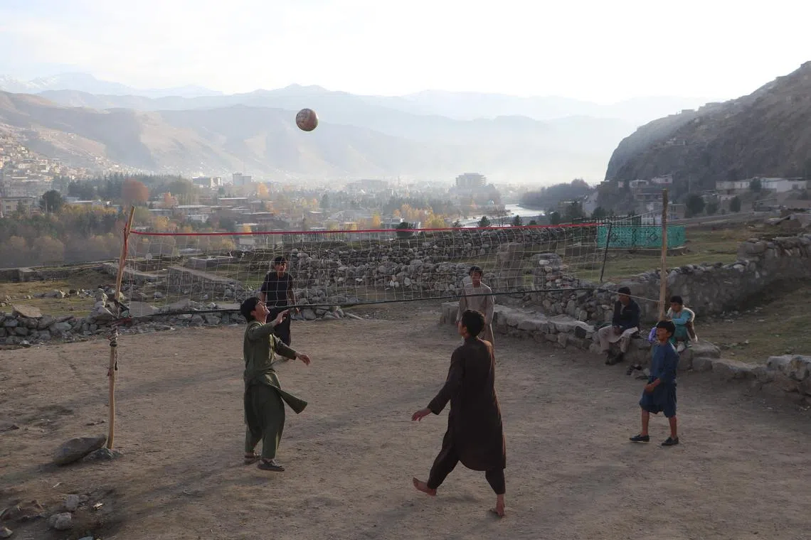Afghan youths play volleyball in Fayzabad district of Badakhshan province on Nov 28.