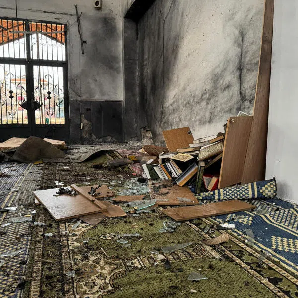 The interior of a damaged mosque after several people were killed in an explosion at a mosque of the Alawite minority sect in Homs, Syria, on Dec 26.