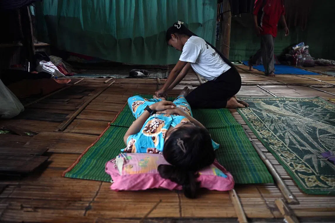 A recovering drug addict from Myanmar getting a therapeutic massage during a rehabilitation programme at an undisclosed location in Mae Sot along the Thai-Myanmar border. 