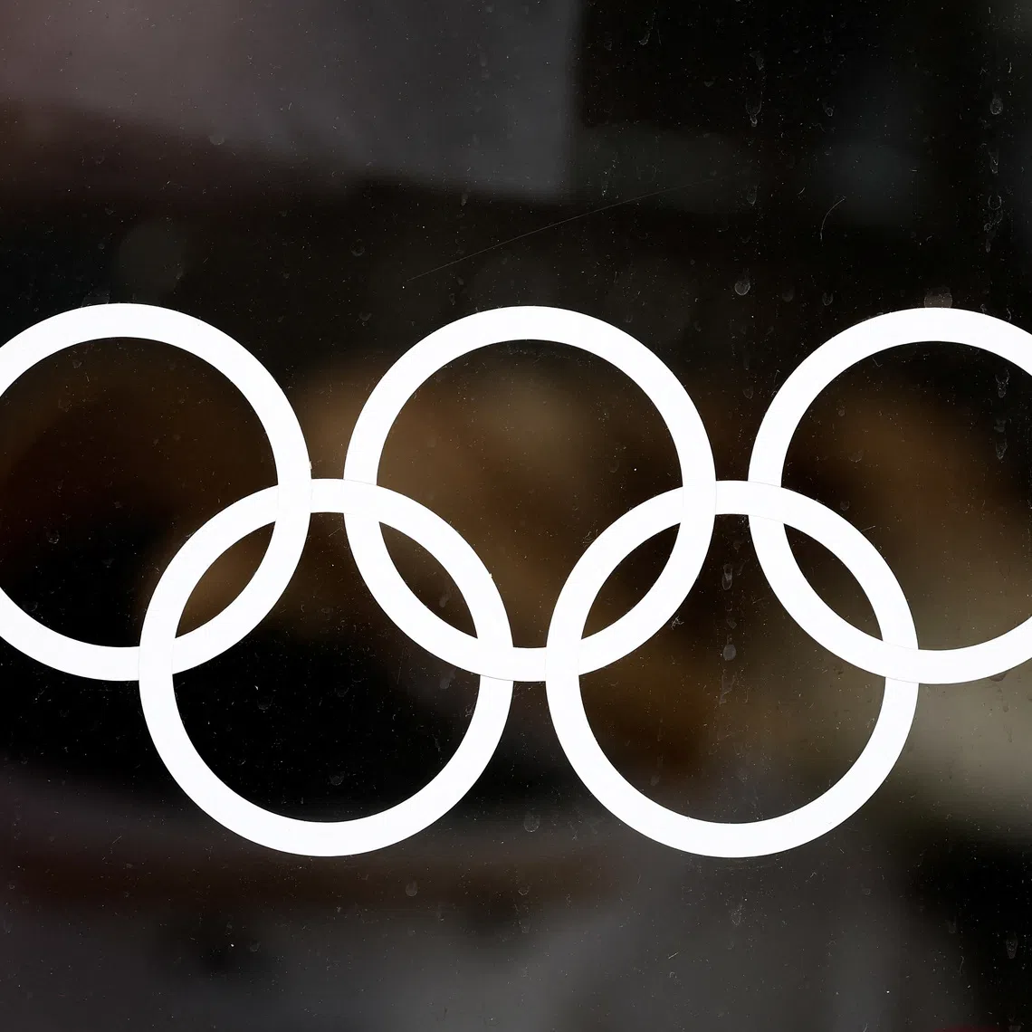 FILE PHOTO: Part of the logo of the Paris 2024 Olympic and Paralympic Games is seen on an official Paris 2024 store at Place de l'Opera in Paris, France, January 1, 2024. REUTERS/Benoit Tessier/File photo
