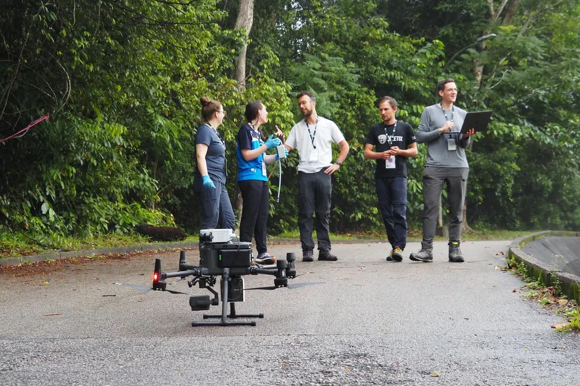 The ETH BiodivX team deploying its water sampling drone.