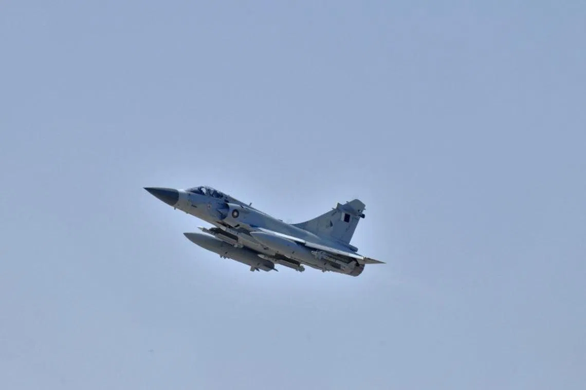 FILE PHOTO: A Qatar Emiri Air Force Dassault Mirage 2000-5 fighter jet takes off as part of a Joint Task Force Odyssey Dawn mission in Souda Bay in Greece, March 25, 2011. REUTERS/Paul Farley/U.S. Navy Photo/Handout/File Photo