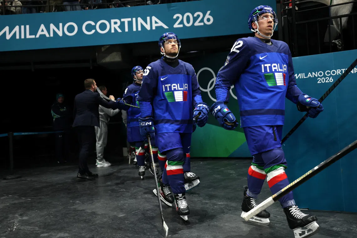 FILE PHOTO: Milano Cortina 2026 Olympics - Ice Hockey - Men's Preliminary Round - Group B - Sweden vs Italy - Milano Santagiulia Ice Hockey Arena, Milan, Italy - February 11, 2026. Diego Kostner of Italy and Luca Zanatta of Italy before the match REUTERS/Mike Segar/File Photo