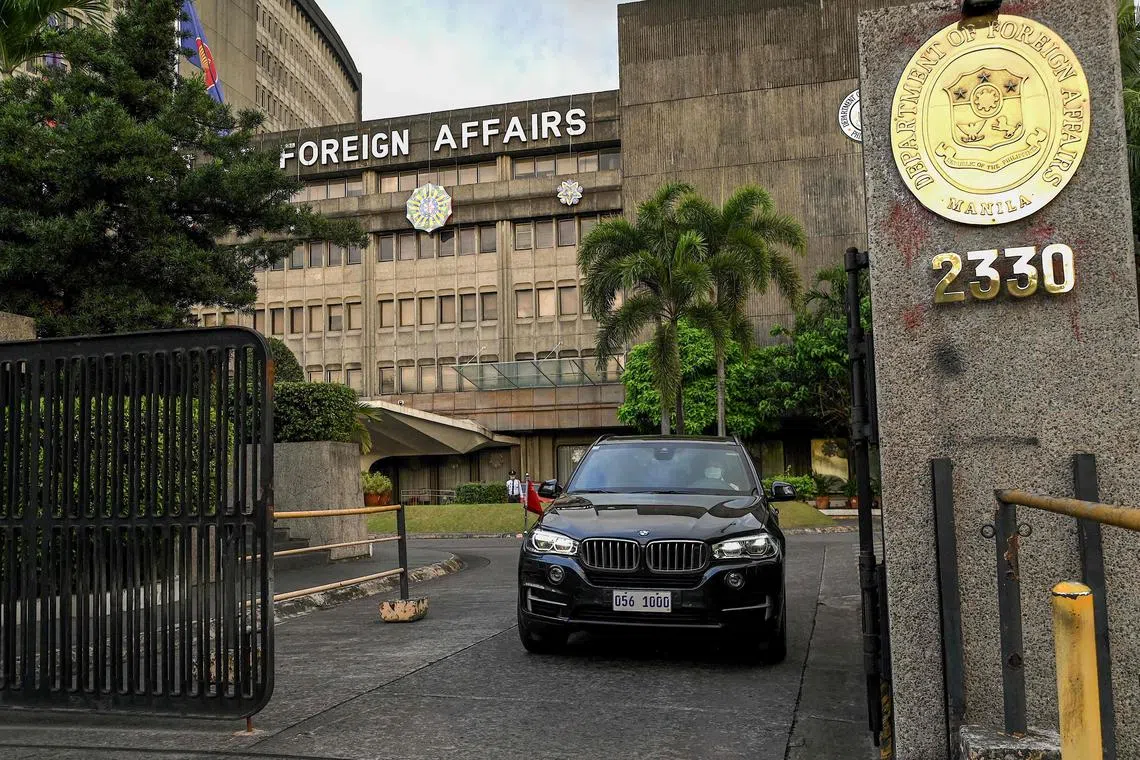 A Chinese diplomatic vehicle leaves the Department of Foreign Affairs in Manila on Dec 11, 2023.  
