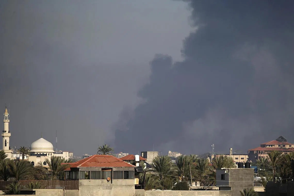 Smoke rises following Israeli air strikes in Gaza City, as seen from Al Nusairat refugee camp, in the southern Gaza Strip.