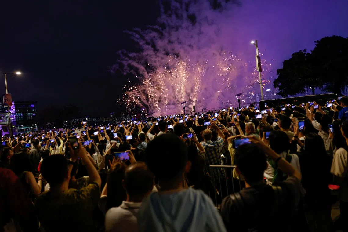 Fireworks light up over Victoria Harbour for the Chinese Labour Day 'Golden Week' holiday, in Hong Kong, China May 1, 2024. REUTERS/Tyrone Siu/File Photo