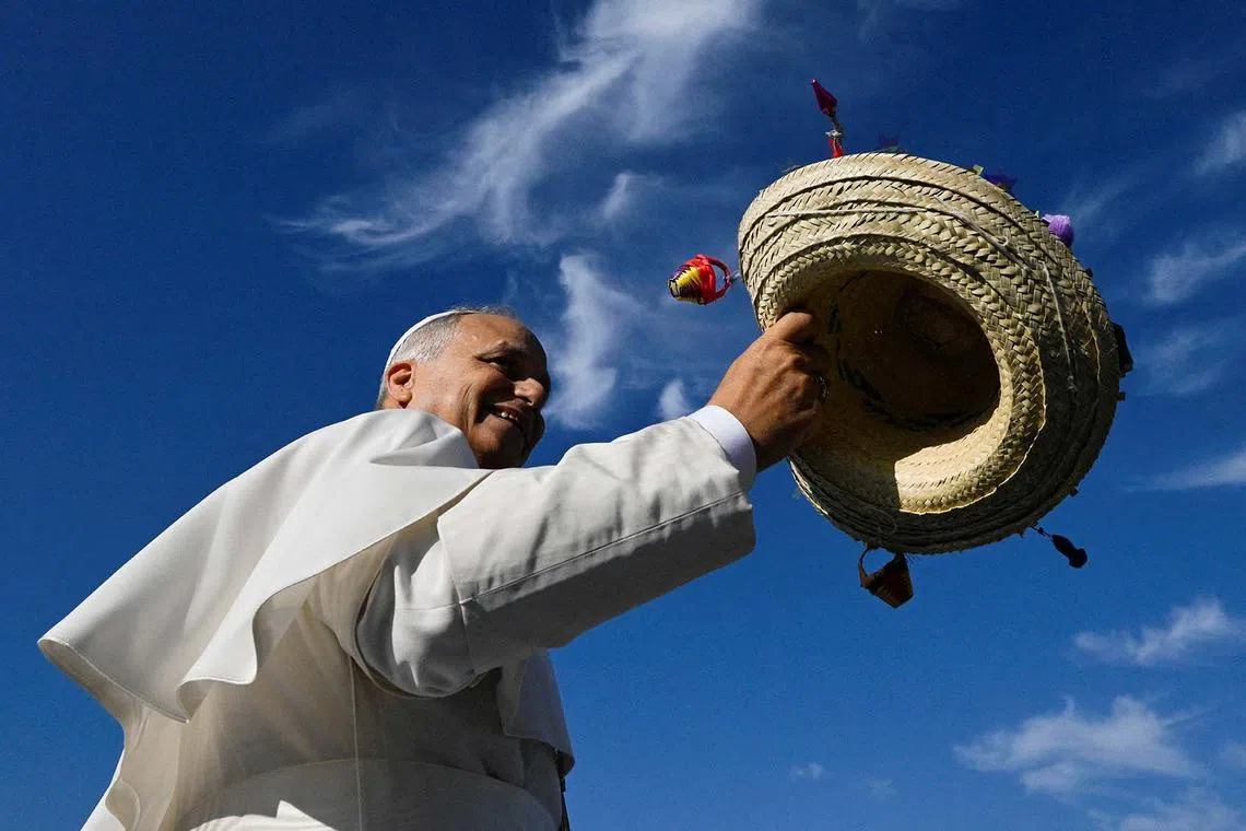 Pope Leo XIV holding a hat on the day of a Mass for Jubilee of Youth in Tor Vergata, in Rome, Italy, Aug 3, 2025. 