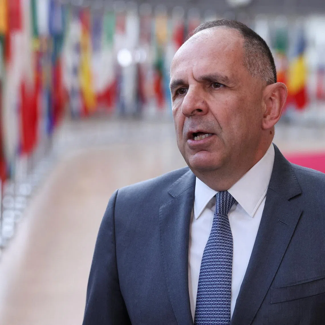 Greek Foreign Minister George Gerapetritis speaks to members of the media as he arrives to attend a European Union Energy and Foreign Affairs ministers meeting in Brussels, Belgium, March 16, 2026. REUTERS/Omar Havana