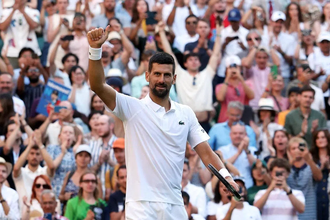 Serbia's Novak Djokovic celebrates after winning his quarter-final match against Italy's Flavio Cobolli.  
