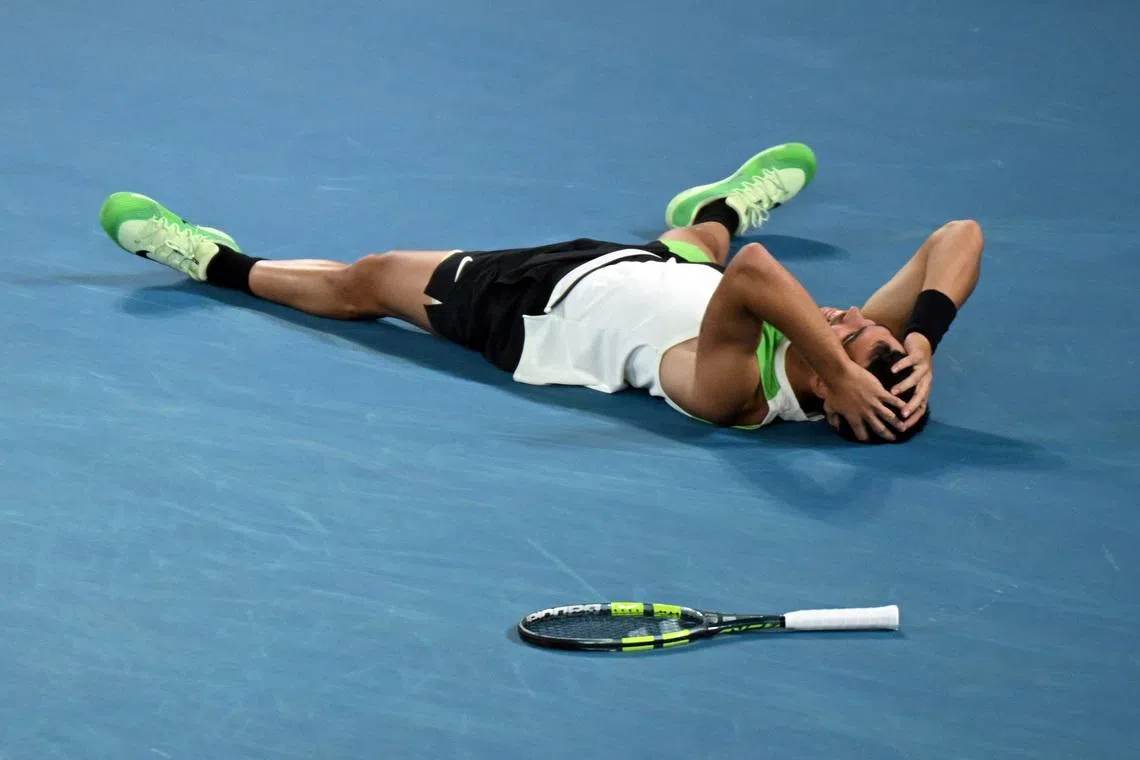 Tennis - Australian Open - Melbourne Park, Melbourne, Australia - February 1, 2026 Spain's Carlos Alcaraz celebrates after winning the Australian Open men's singles against Serbia's Novak Djokovic. Alcaraz becomes the youngest man to win all four grand slam titles. REUTERS/Jaimi Joy