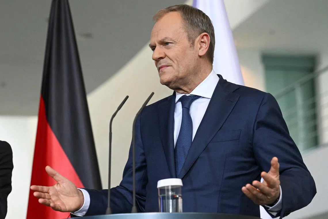 Polish Prime Minister Donald Tusk gestures during a press statement with German Chancellor Olaf Scholz and French President Emmanuel Macron, ahead of their trilateral meeting of the consultation forum 'Weimar Triangle', at the Chancellery in Berlin, Germany March 15, 2024. REUTERS/Annegret Hilse/ File photo