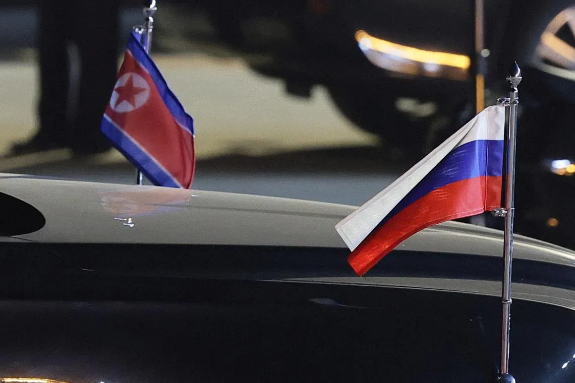 A view shows flags of Russia and North Korea attached to a car during a ceremony welcoming Russia's President Vladimir Putin at an airport in Pyongyang, North Korea June 19, 2024. Sputnik/Vladimir Smirnov/Pool via REUTERS/Files