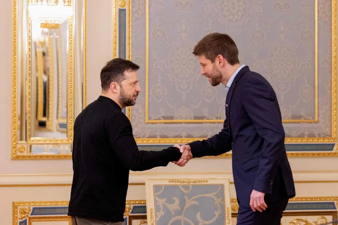 Ukrainian President Volodymyr Zelensky (left) welcoming Mr Michal Simecka, leader of Slovakia's opposition Progressive Slovakia party, to Kyiv on Jan 17.