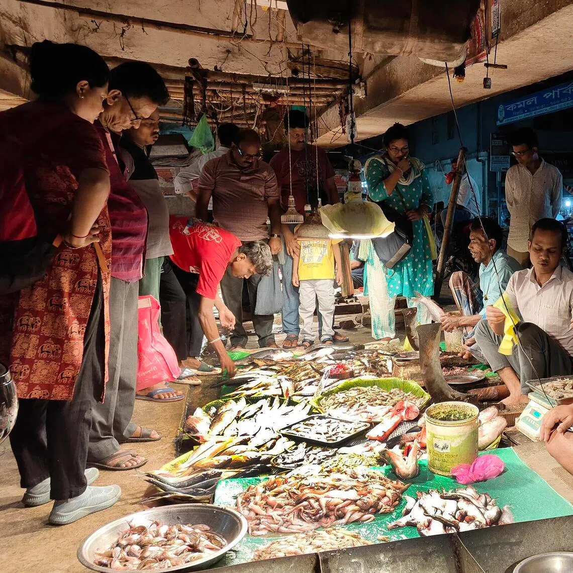 Bengalis buying fish at one of Kolkata's many neighbourhood fish markets on March 11. The Bengali love for fish is legendary.