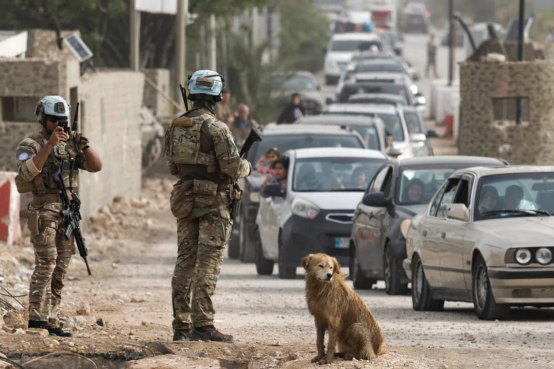 French UN peacekeepers stand near the bridge linking southern Lebanon to the rest of the country, in Qasmiyeh, Lebanon, April 18, 2026. REUTERS/Louisa Gouliamaki