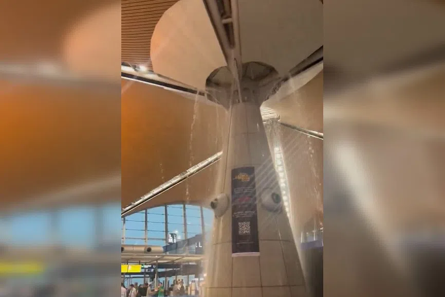 Videos posted on social media platform X showed water pouring from the ceiling near a Qatar Airways check-in counter. 