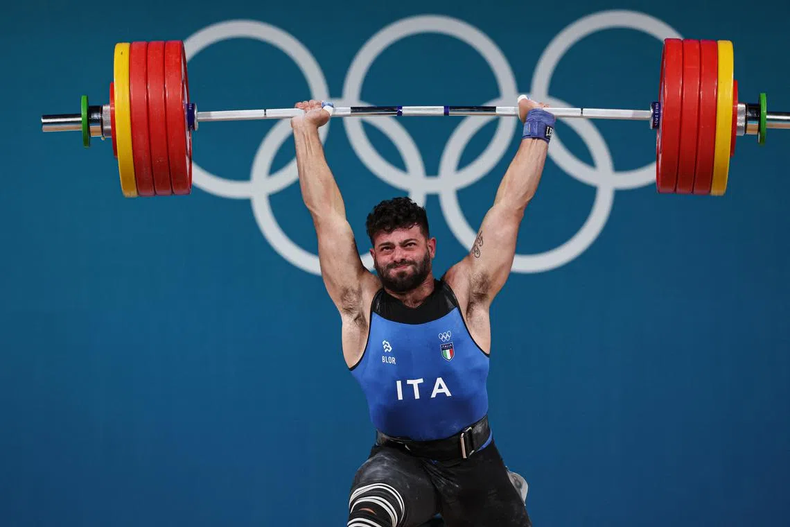 Paris 2024 Olympics - Weightlifting - Men's 89kg - South Paris Arena 6, Paris, France - August 09, 2024. Antonino Pizzolato of Italy in action. REUTERS/Amanda Perobelli