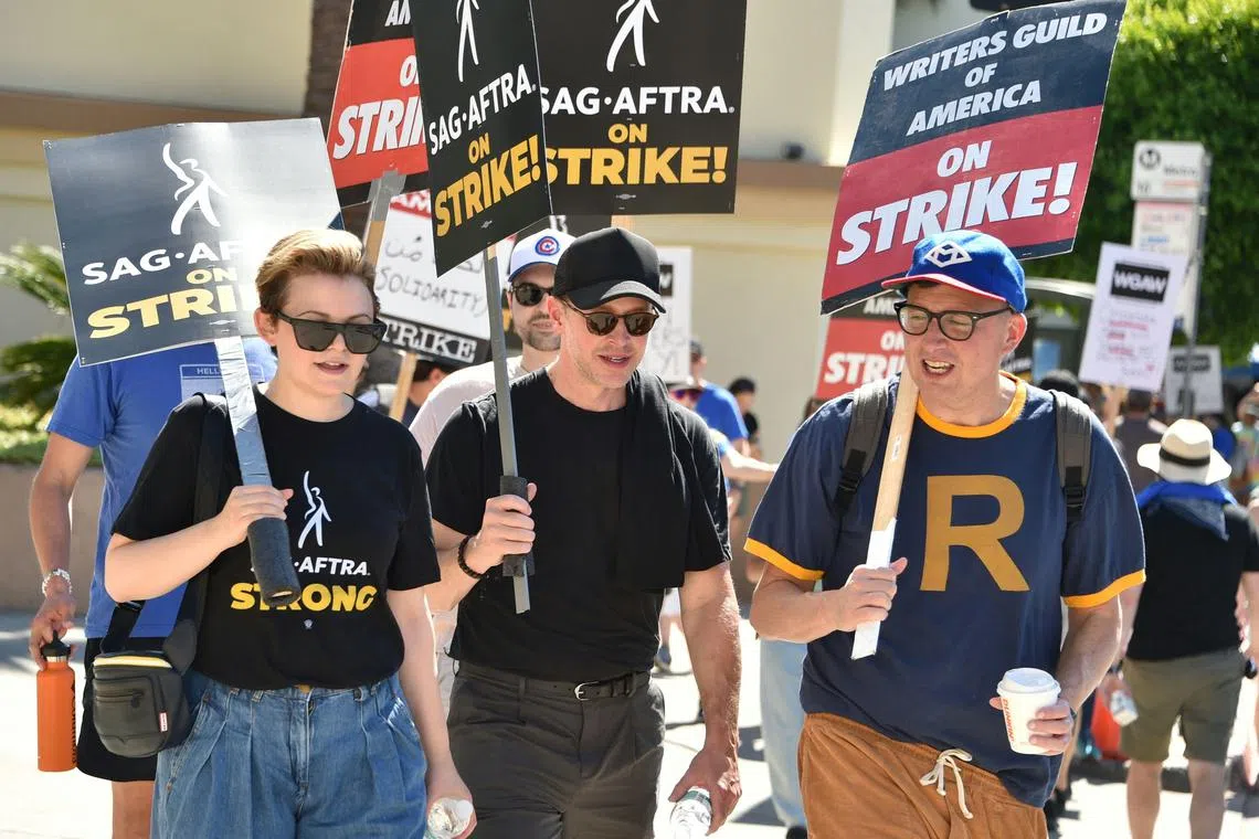 US actress Ginnifer Goodwin (left) joins striking writers outside Paramount Pictures studios in Los Angeles, California.
