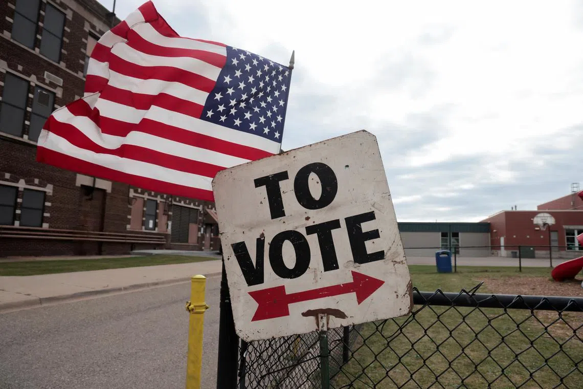 A sign shows people where to vote in the 2024 presidential election on Election Day in Dearborn, Michigan, U.S., November 5, 2024. REUTERS/Rebecca Cook