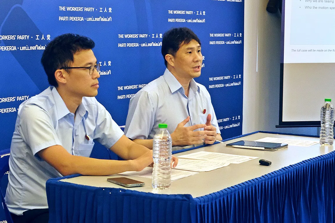 Workers’ Party MPs Kenneth Tiong and Jamus Lim explaining the motion their party will table in Parliament at a press briefing on Aug 1.