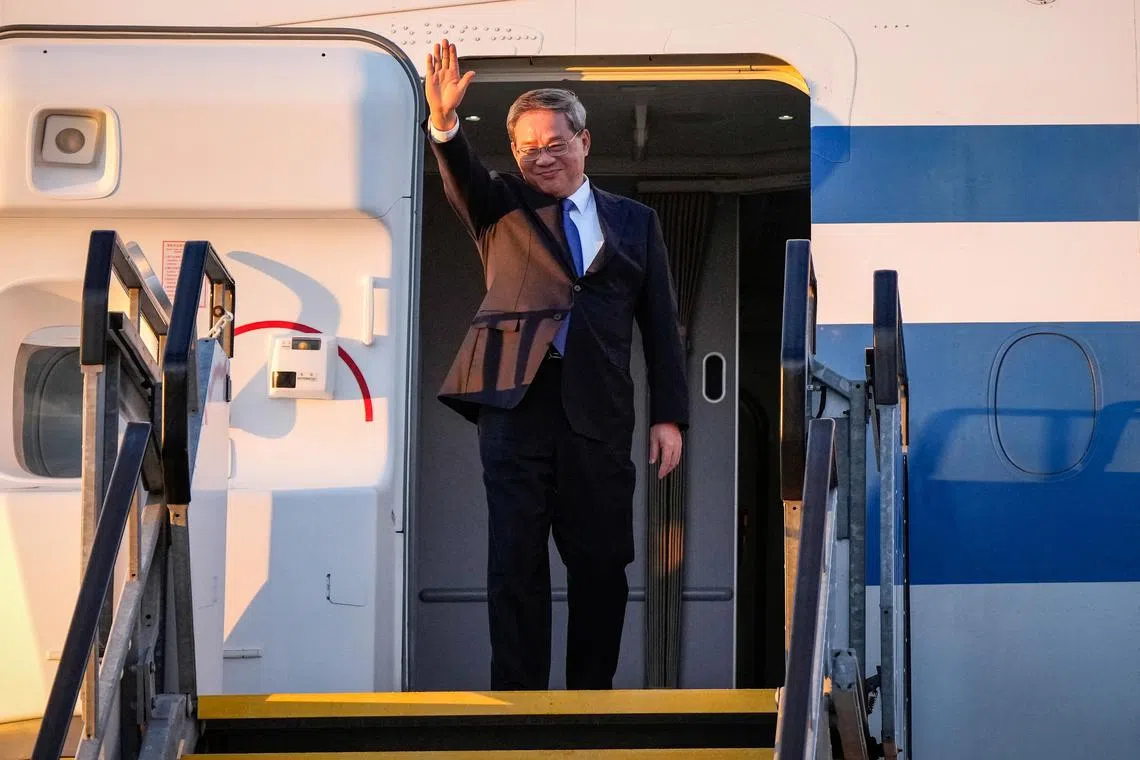 China's Premier Li Qiang waving after his arrival at Adelaide Airport on June 15.