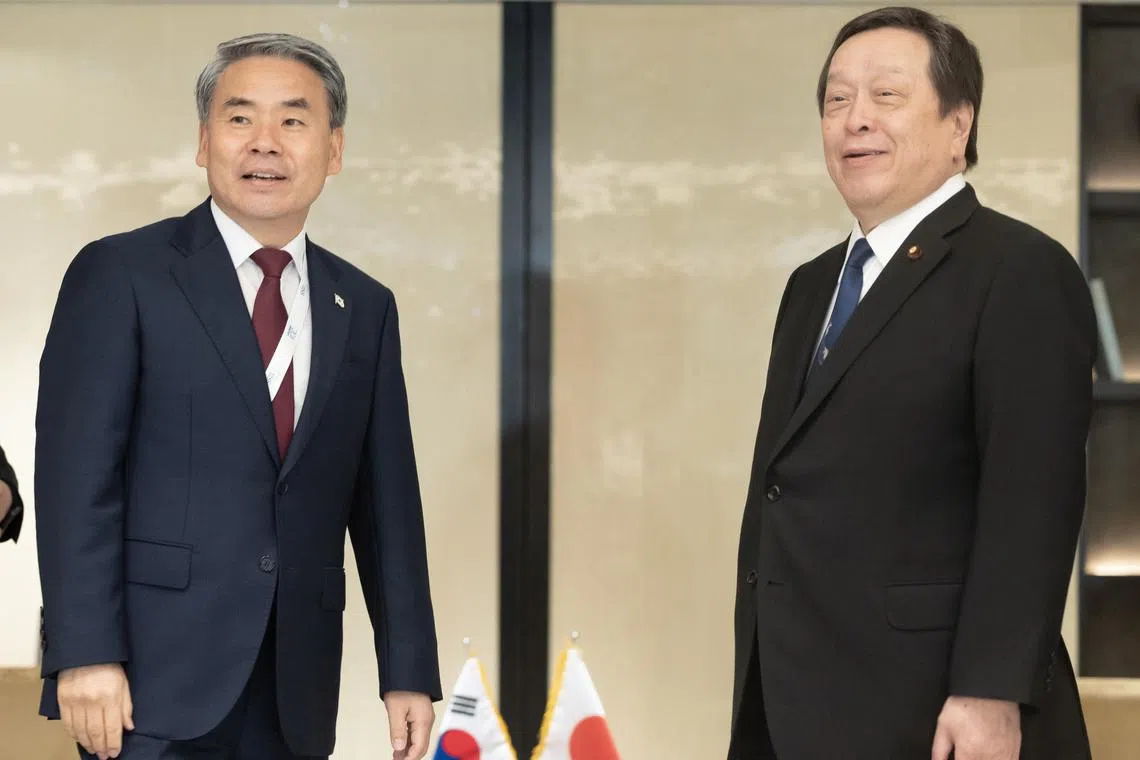 South Korean Defence Minister Lee Jong-sup (L) and his Japanese counterpart, Yasukazu Hamada (R), meet for bilateral talks on the margins of the annual Shangri-La Dialogue in Singapore on June 4, 2023. 