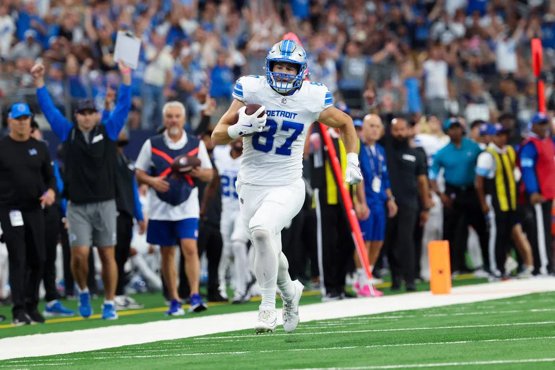 Oct 13, 2024; Arlington, Texas, USA;  Detroit Lions tight end Sam LaPorta (87) runs for a touchdown during the second quarter at AT&T Stadium. Mandatory Credit: Kevin Jairaj-Imagn Images/ File Photo