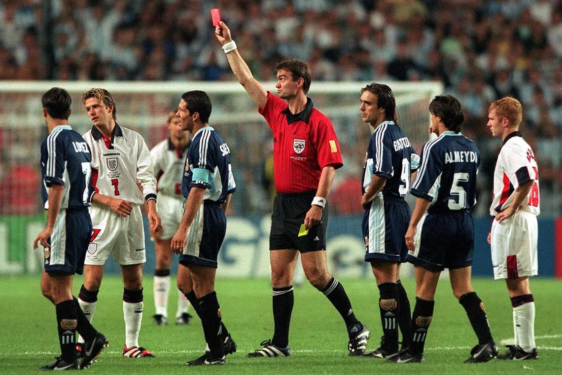 FILE PHOTO: Football - 1998 FIFA World Cup - Second Round - England v Argentina - Stade Geoffroy Guichard, Saint Etienne - 30/6/98   Pic : Darren Walsh / Action Images    England's David Beckham is shown the red card/File Photo